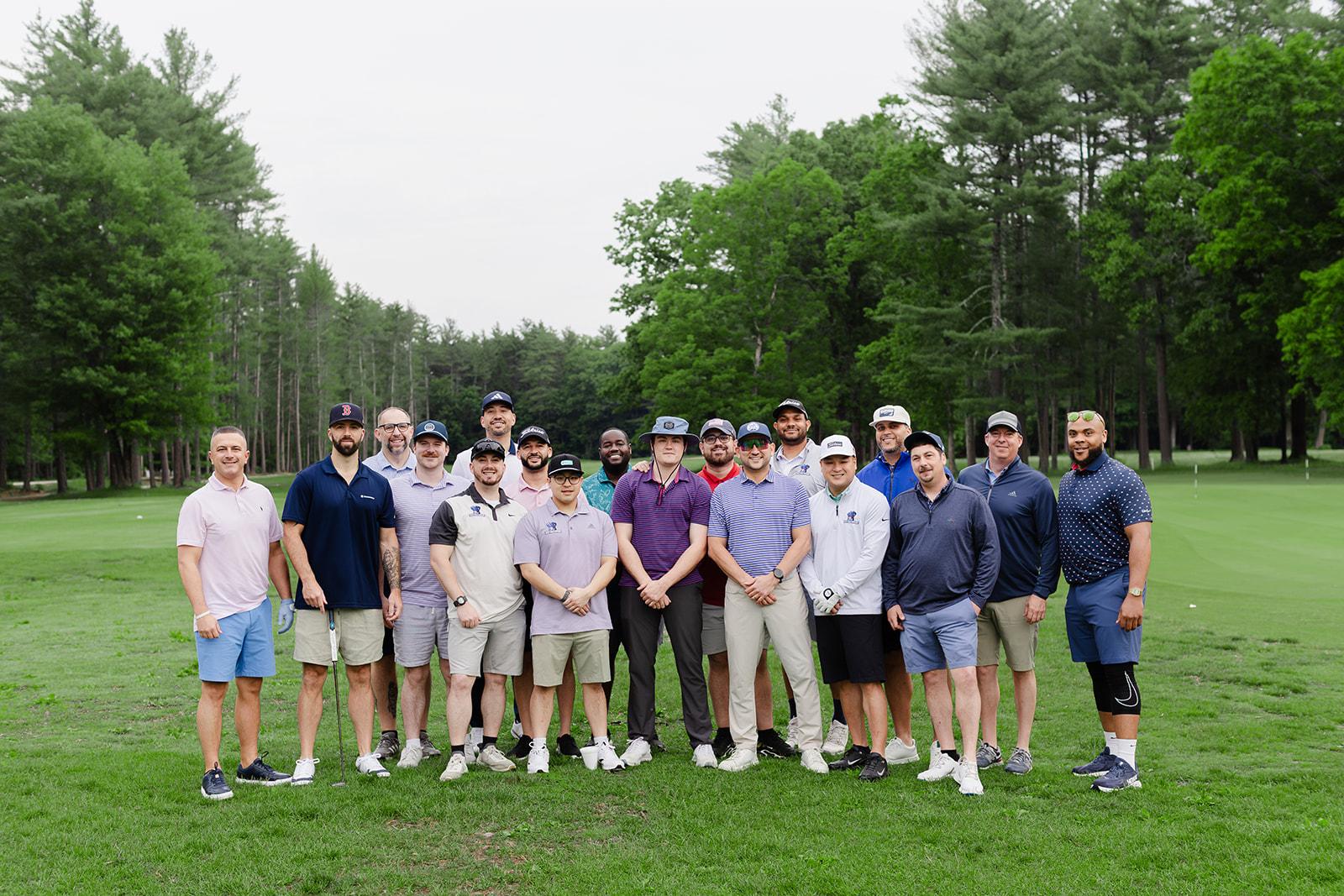 The full Patriot Family Insurance team posing together on the fairway at the annual golf outing