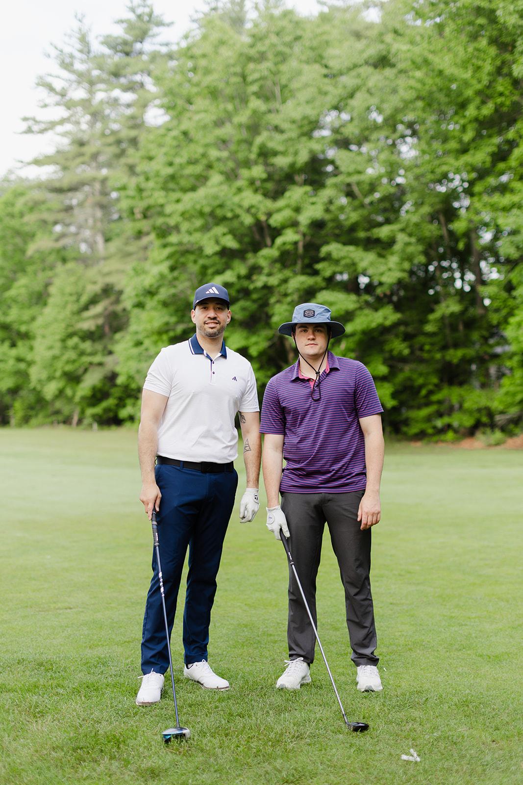 Two teammates out on the course at the Patriot Family golf outing