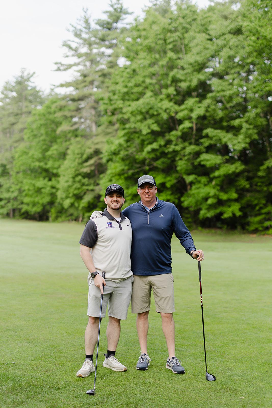 Two Patriot team members celebrating a great round side by side